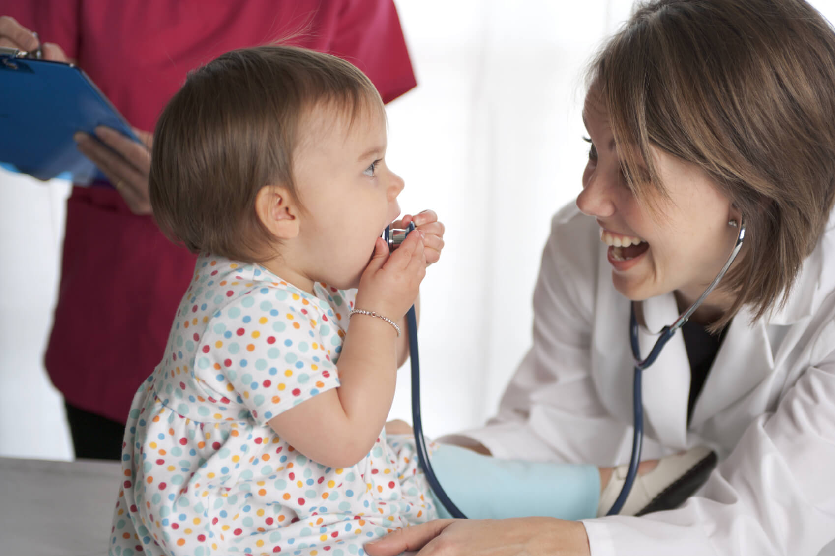 baby playing with stethoscope
