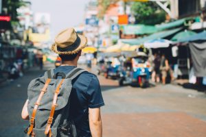 Young traveling backpacker in Khaosan Road outdoor market in Bangkok, Thailand iStock twinsterphoto